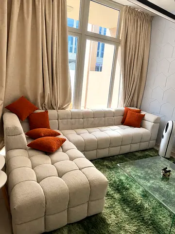 Beige L-shaped Tufted Sofa with round table
