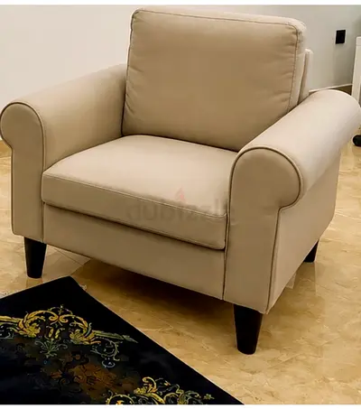 Beige Leather Armchair with Cushioned Back and Rolled Arms