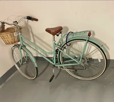 Vintage-style mint city bike with front basket — good condition