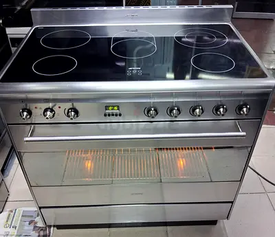 Smeg latest model 5 burner electric ceramic cooker with digital clock light and fan