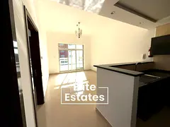 1BR with Balcony | Steps from Souq Extra