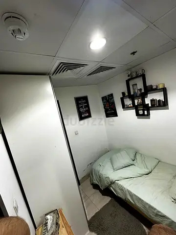 Room in An apartment with clean and Friendly environment, 2 minute walk from Al furjan Metro Station