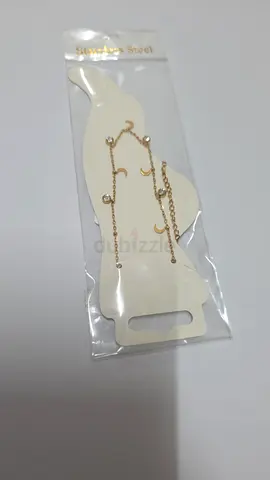 Gold-tone dangling moon and star anklets - new in pack