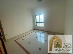 The finest apartment in the heart of Al Majaz 2: a spacious 3-bedroom unit with a living area, locat
