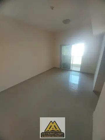 One-bedroom apartment with a living room and a balcony offering an open view, located in the Pearl Towers. It enjoys a prime location