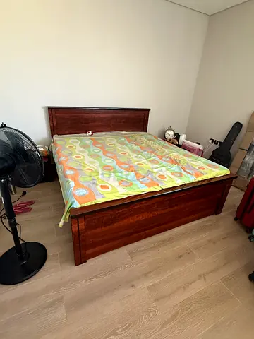 Dark wood king size bed frame with headboard - excellent condition available for sale