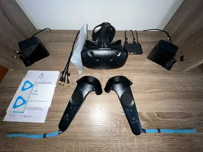 HTC Vive VR headset with controllers and base stations - good condition