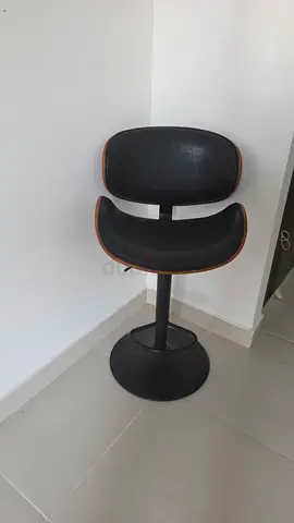 2 Mid-century modern swivel bar stool with black seat and wooden trim. No height adjustment