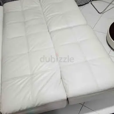 02 pieces White leather sofa cum bed - convertible, good condition
