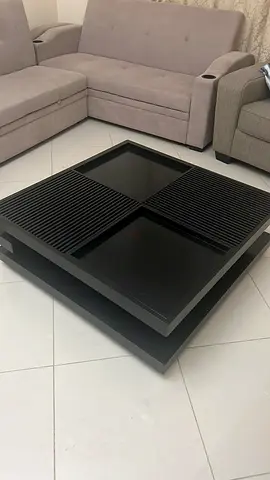 Solid black modern square coffee table with slatted top panels