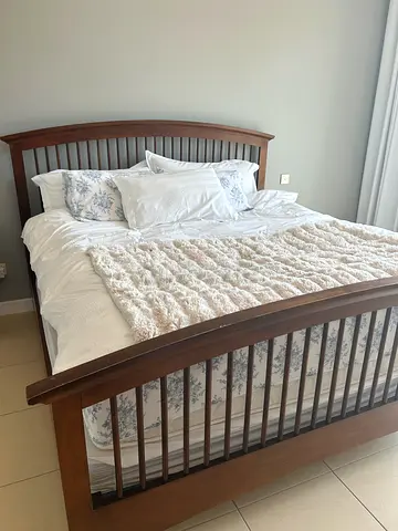 Solid Wood Queen Bed Frame - Good Condition with draws and side table.  Free to a good home
