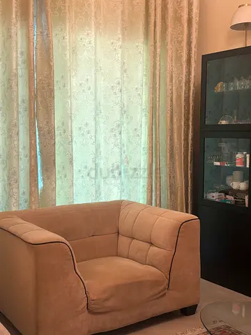 2-seater beige fabric sofa in good condition
