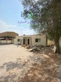20,000 sq ft yard in Al Sajaa with interlock flooring covered shed 32 electricity 2 rooms kitchen ba