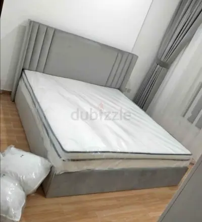Grey upholstered double bed with mattress - good condition