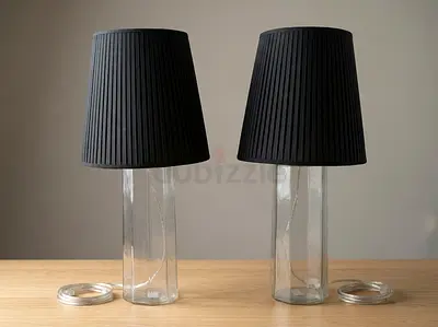 Pair of clear glass table lamps with black pleated shades (75 cm)