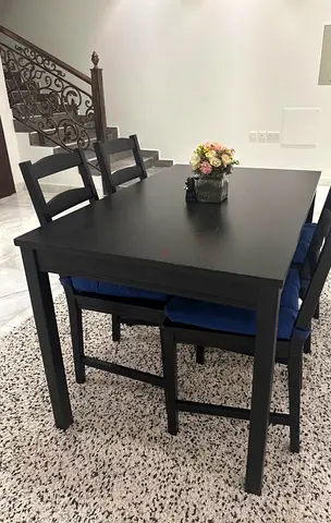 Black wooden dining table with 4 chairs - good condition