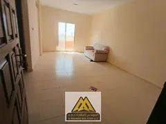 One-bedroom apartment for annual rent in Al Karama, Ajman | Sea view, central air conditioning, and