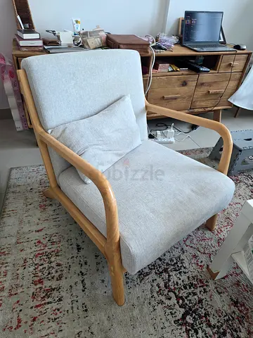 Light wood frame lounge chair with gray cushions