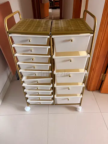 Gold metal rolling storage trolley with 12 white drawers - good condition