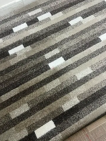 Modern grey geometric area rug — excellent condition