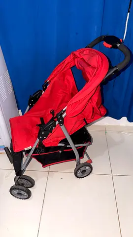 Red lightweight baby stroller / pram - single seat