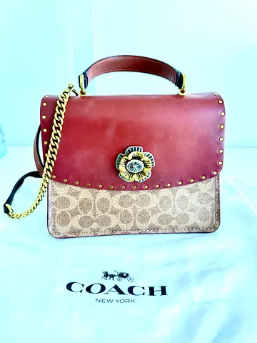 Coach parker leather handbag with gold chain strap and rivets