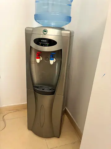 Standing water cooler dispenser - hot & cold taps, with small fridge