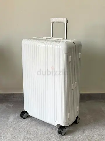 Rimowa white luggage