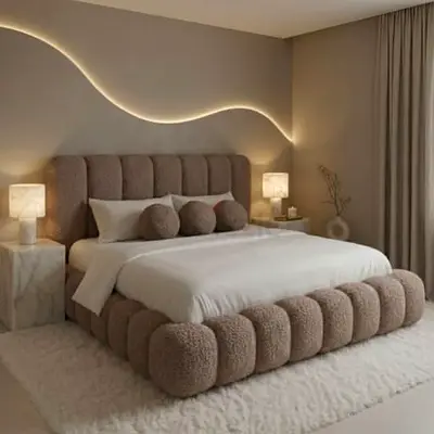 Plush upholstered king bed with tufted rounded base and headboard