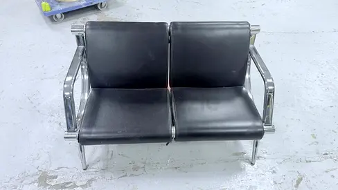 Two-seater black leather waiting room/office sofa with chrome frame