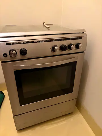 Used freestanding stainless steel gas oven with stovetop