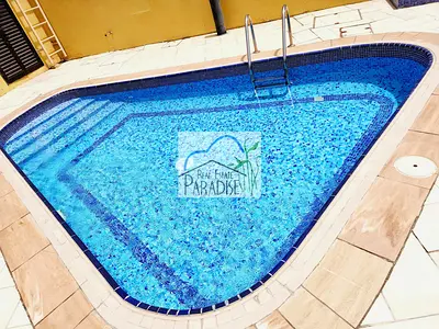 away from fly zone/private entrance 3 bedroom villa with private back lawn garden /fitted kitchen/maids room/shared swimming pool/for rent in mirdif
