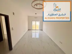 2-bedroom apartment with a living room, balcony, split AC, 3 bathrooms, and easy access to Sharjah a