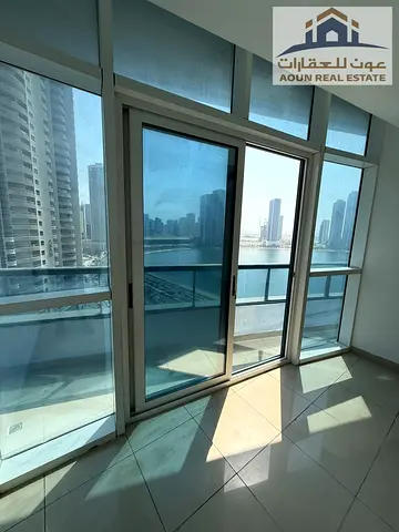 Al Mamzar | Two-bedroom apartment with a living room with full view | Two balconies | Large maid's room | Kitchen storage | Fully maintained | Free gy