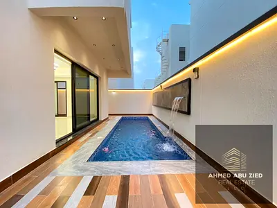 5 master bedrooms, a large living area, a swimming pool, a spacious rooftop terrace, a maid's room, and a large, fully equipped kitchen. Features 7 ba