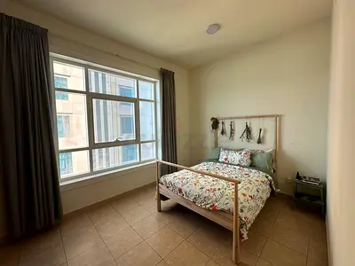 Light wood double 140x200 IKEA Gjora bed frame with mattress and floral bedding.