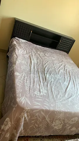 Queen bed with built-in wooden headboard and storage - dark finish