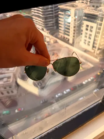 Ray Ban Aviator sunglasses with dark green lenses - good condition