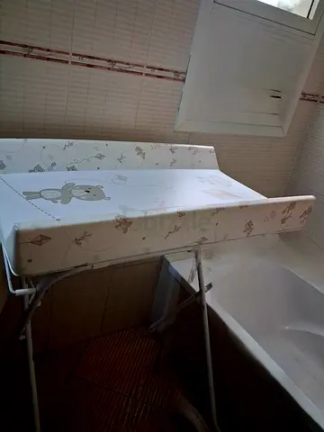 Portable - foldable baby changing table with padded changing mat and free baby bath tub