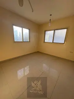 For annual rent, a two-bedroom apartment with a living room in Al Musalla, located behind Grand Mall