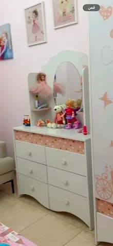 Dressing table with mirror and six drawers, and a white and pink wardrobe for young girls / three-do