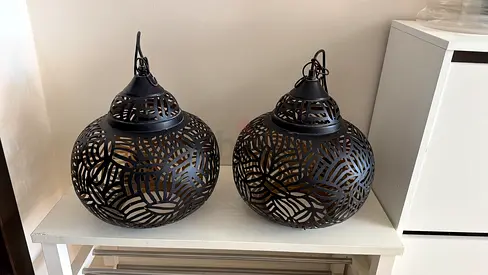 Pair of decorative metal pendant lanterns — black cutout design