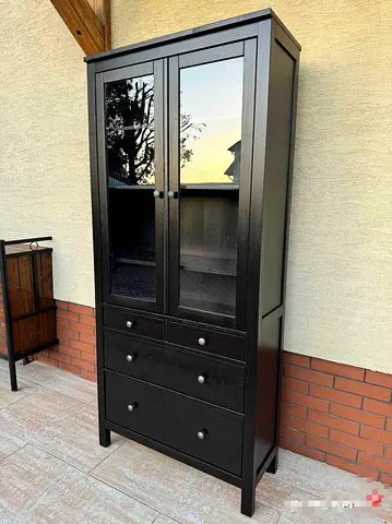 Tall dark wood cabinet with glass doors and drawers - good condition