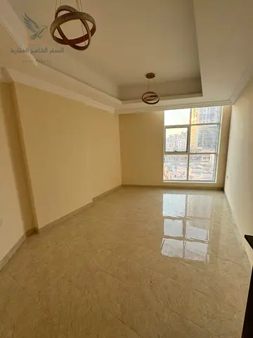 For annual rent 3 bedrooms and a living room in Al Rawda 2 Ajman Spacious living room balcony with open views bathrooms and private parking