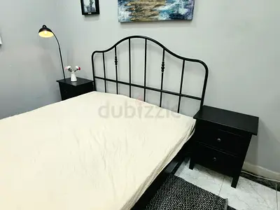 Black Metal Frame Bed with Matching Nightstands