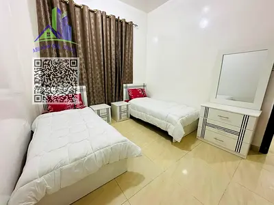 Two-bedroom apartment with a living room for monthly rent in Al Muwaihat 2, Ajman (Sheikh Ammar Street).
