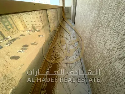 2BR in Al Butaina, 2nd tenant, balcony, open view, central AC/gas, 3 baths. AED 45K.
