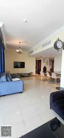 Luxury two-bedroom apartment with a living room and city view for sale.