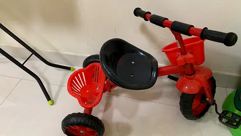 Red toddler tricycle - sturdy plastic seat, three wheels, good condition