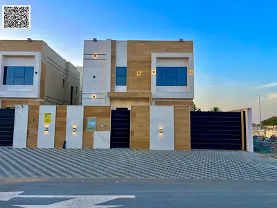 Villa for sale in Al Zahia, Ajman: features 3 master bedrooms, a majlis, a living area, and a maid's room. Registration fees included; freehold owners